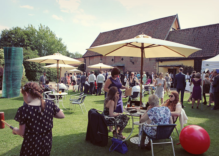 A summer wedding reception on the lawns at Haughley Park Barn Wedding Venue photographed by Suffolk Wedding Photographers Hayley Denston Photography