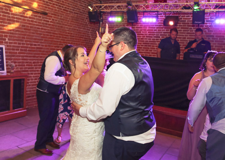 A bride and groom dancing together at their disco at Haughley Park Barn Wedding Venue photographed by Suffolk Wedding Photographers Hayley Denston Photography