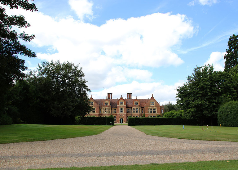 Haughley Park Barn main hall with croquet on the lawn for a summer wedding at Haughley Park Barn Wedding Venue photographed by Suffolk Wedding Photographers Hayley Denston Photography