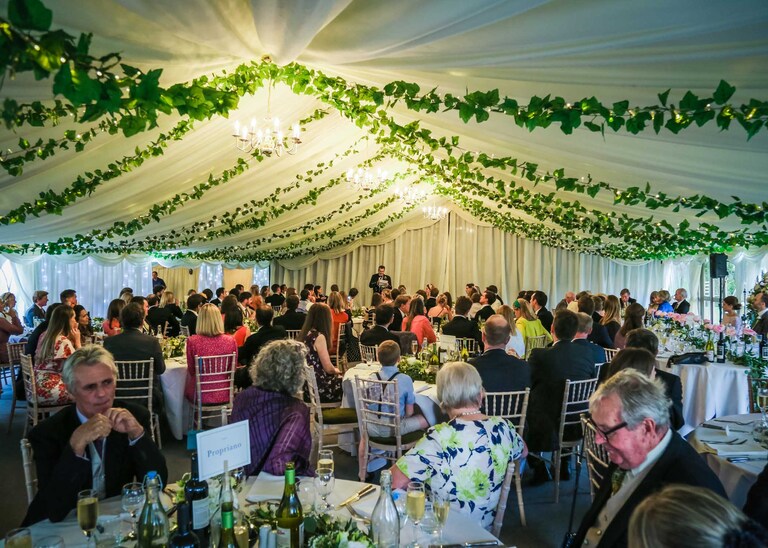 Inside the marquee for wedding speeches at Hungarian Hall Wedding Venue photographed by Suffolk Wedding Photographers Hayley Denston Photography