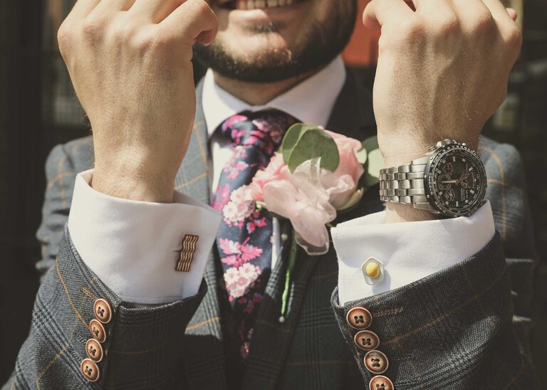 A grooms eggs and bacon cufflinks on a wedding day at Bury St Edmunds Registry Office in Suffolk captured by Suffolk Wedding Photographers Hayley Denston Photography
