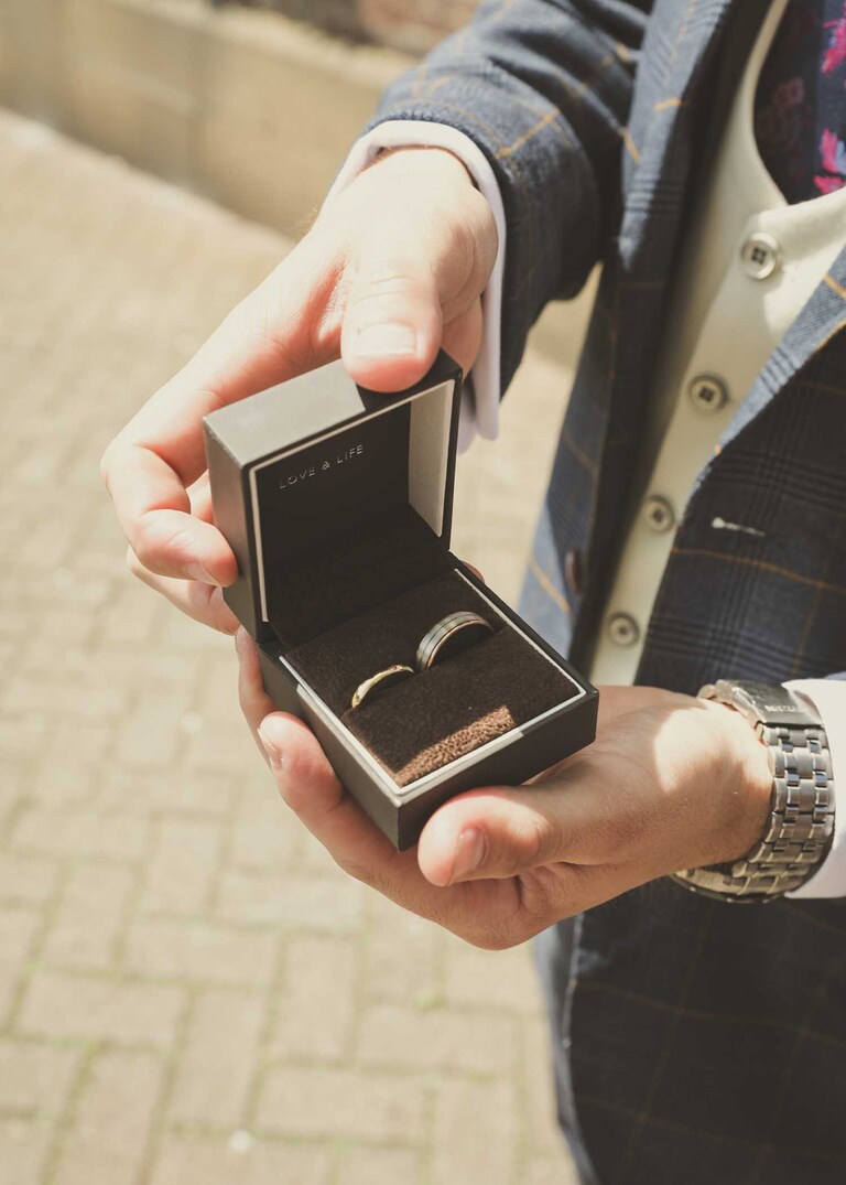 Wedding rings before the ceremony on a wedding day at Bury St Edmunds Registry Office in Suffolk captured by Suffolk Wedding Photographers Hayley Denston Photography