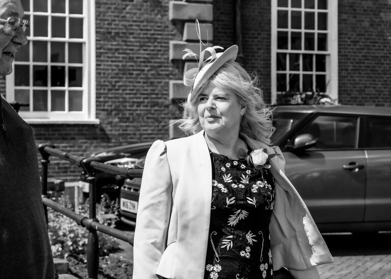 The brides mum looking beautiful before the ceremony on a wedding day at Bury St Edmunds Registry Office in Suffolk captured by Suffolk Wedding Photographers Hayley Denston Photography