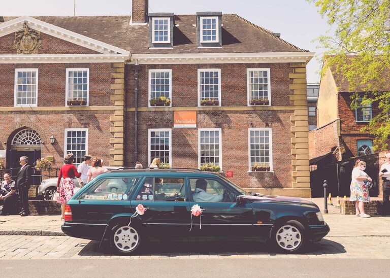 A vintage mercedes car on a wedding day at Bury St Edmunds Registry Office in Suffolk captured by Suffolk Wedding Photographers Hayley Denston Photography