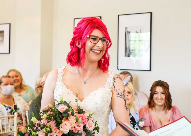 A bride during her wedding ceremony at Bury St Edmunds Registry Office on her wedding day in Suffolk captured by Suffolk Wedding Photographers Hayley Denston Photography