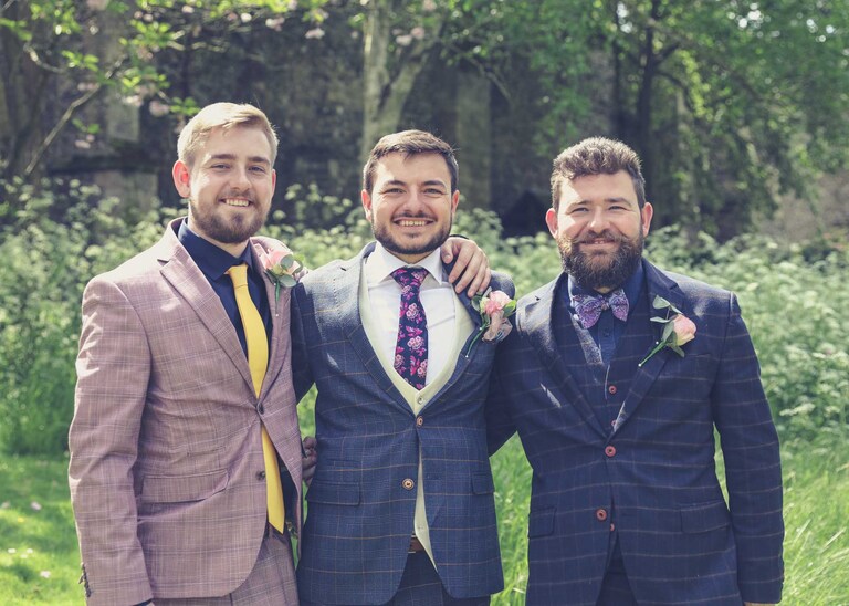 A groom and his bestmen in the Abbey Gardens in Bury St Edmunds on a wedding day in Suffolk captured by Suffolk Wedding Photographers Hayley Denston Photography