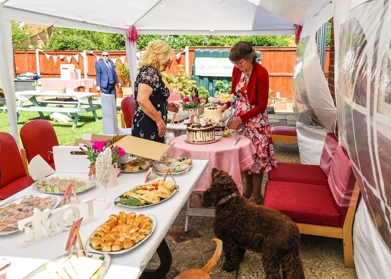 Mum's making a wedding buffet on a wedding day in Suffolk captured by Suffolk Wedding Photographers Hayley Denston Photography