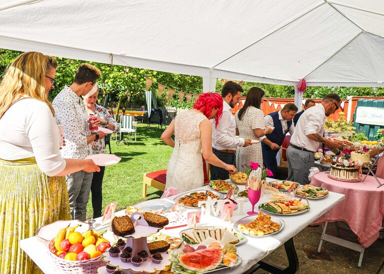 Guests getting their wedding breakfast on a wedding day in Suffolk captured by Suffolk Wedding Photographers Hayley Denston Photography