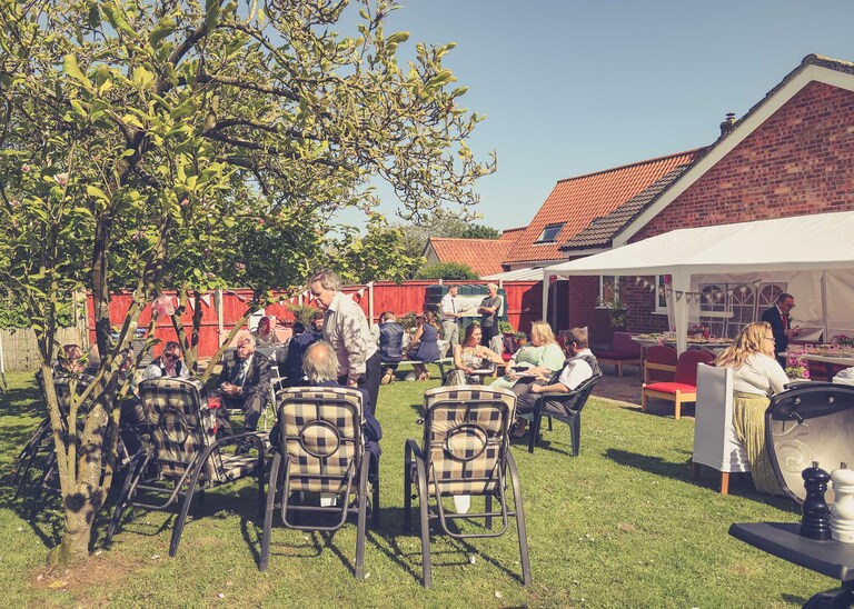 An afternoon tea with guests on a wedding day in Suffolk captured by Suffolk Wedding Photographers Hayley Denston Photography
