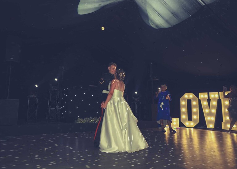 A bride and groom having their first dance at Hungarian Hall on a Wedding Day photographed by Suffolk Wedding Photographers Hayley Denston Photography