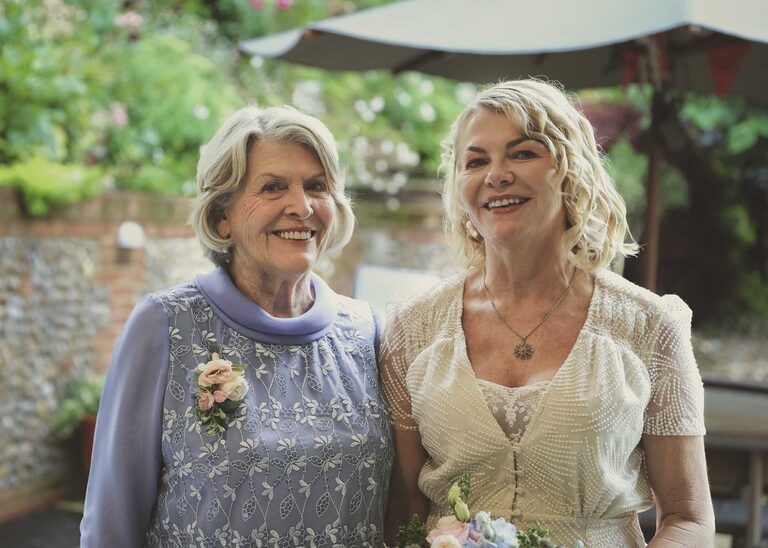 A bride and her mum at Letheringham Water Mill on a wedding day by Suffolk Wedding Photographers Hayley Denston Photography