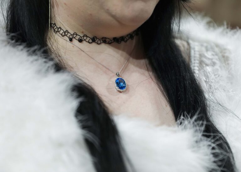 A brides blue sapphire necklace at a wedding at Ipswich Town Hall taken by Suffolk Wedding Photographer Hayley Denston Photography