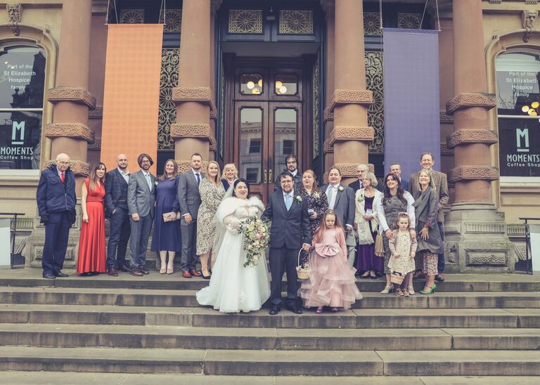 A large group photo on a wedding day at Ipswich Town Hall taken by Suffolk Wedding Photographer Hayley Denston Photography