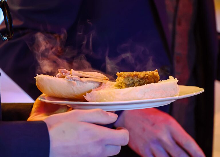 A plate of hog roast at a wedding reception at the Tithe Barn Sproughton on a wedding day taken by Suffolk Wedding Photographer Hayley Denston Photography