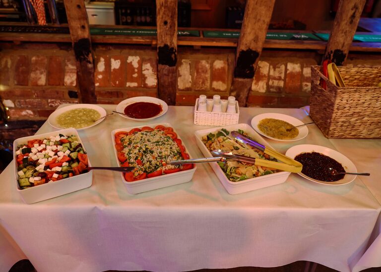 Salads at a wedding reception at the Tithe Barn Sproughton on a wedding day taken by Suffolk Wedding Photographer Hayley Denston Photography