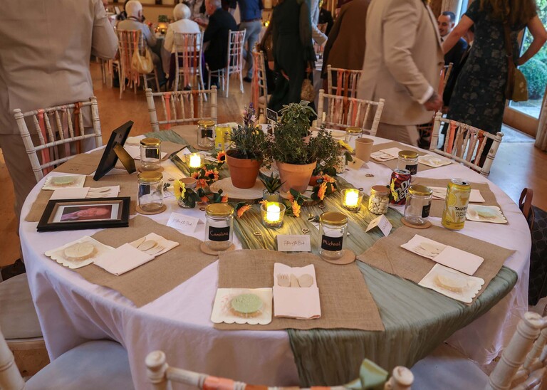 A beautiful autumnally decorated wedding breakfast round table on a wedding day at the Garden Barn, Little Bradley captured by Hayley Denston Photography