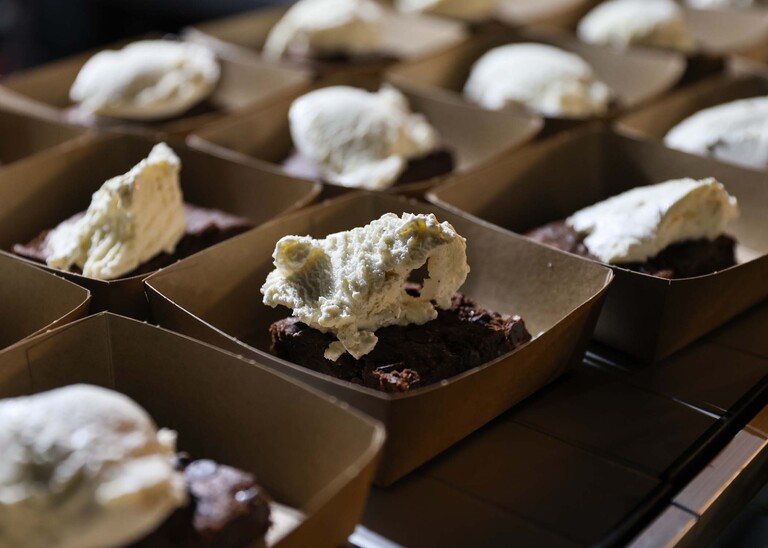 A vegan chocolate brownie and vegan icecream on a wedding day at the Garden Barn, Little Bradley captured by Hayley Denston Photography