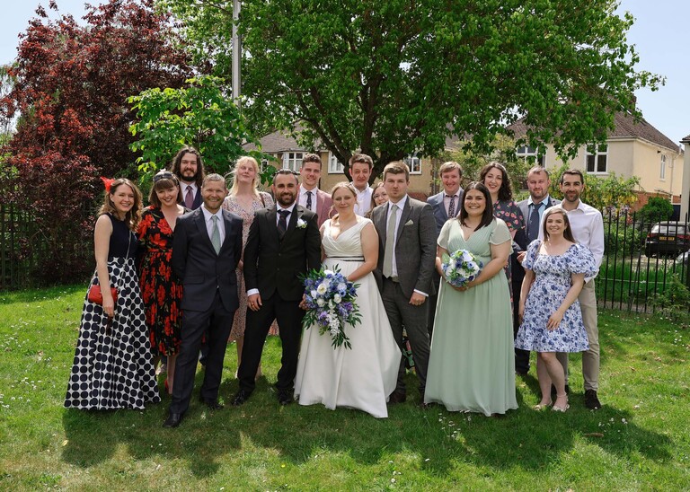 A large formal group shot of a bride and groom and their friends  photographed by Suffolk Wedding Photographer Hayley Denston Photography