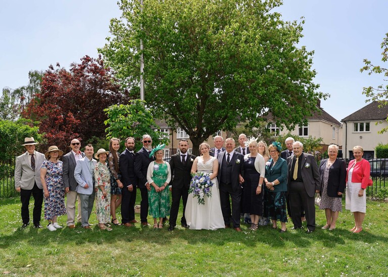 A large group shot of a bride and groom and their families  photographed by Suffolk Wedding Photographer Hayley Denston Photography