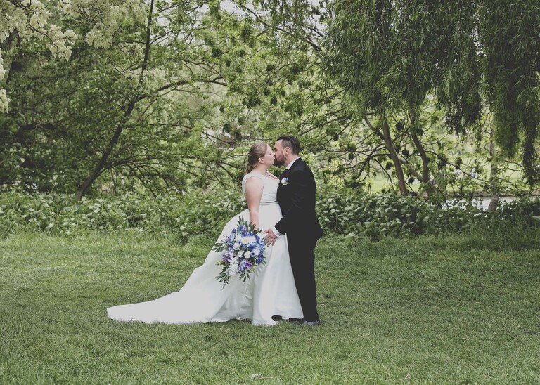 A bride and groom in Meadows down at Cambridge Mill Pond on their wedding day photographed by Suffolk Wedding Photographer Hayley Denston Photography