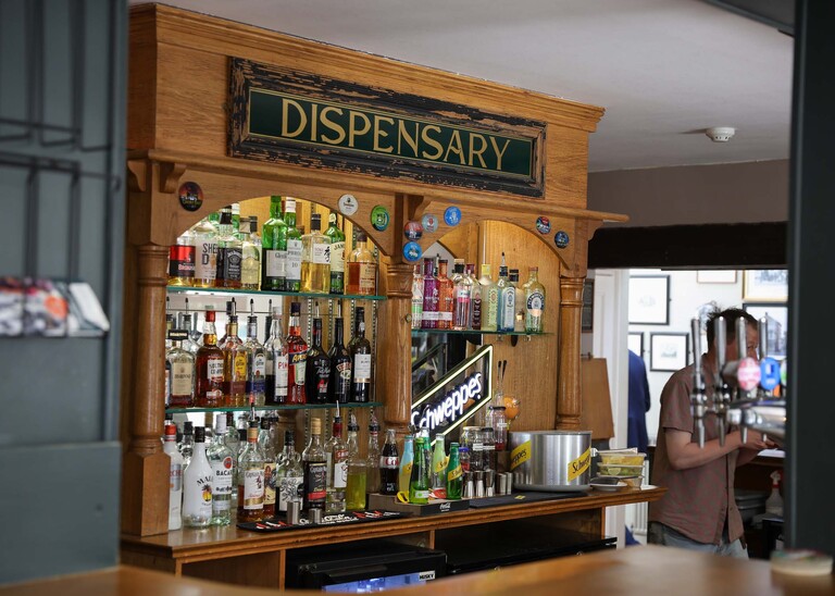 The bar called the dispensary at the Castle Inn in Cambridge on a wedding day  photographed by Suffolk Wedding Photographer Hayley Denston Photography