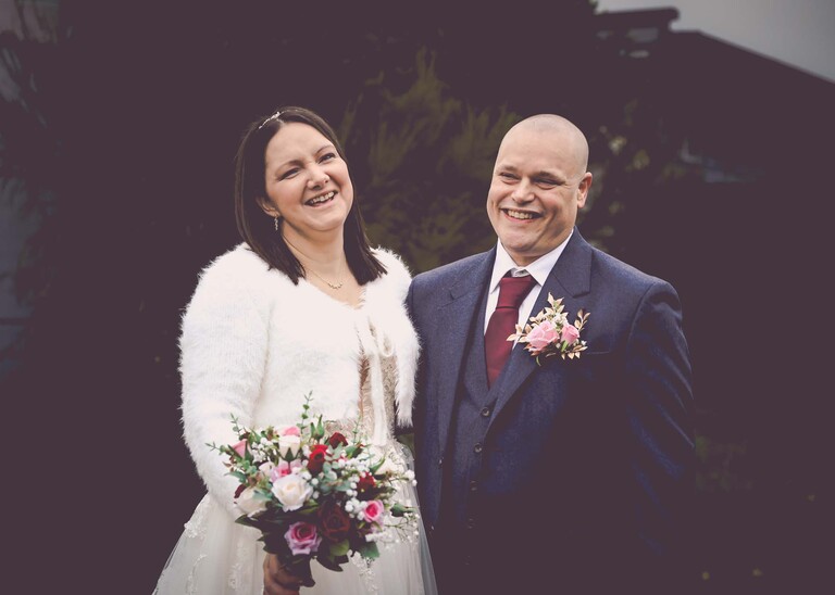 A winter wedding with a bride and groom laughing at Suffolk Wedding Venue 16 photographed by Suffolk Wedding Photographer Hayley Denston Photography