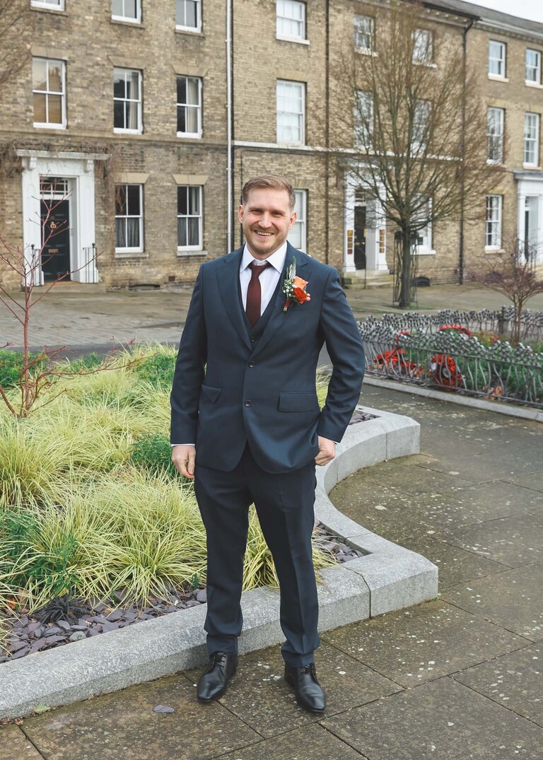 A groom in a blue suit before his ceremony bury st edmunds on a wedding day photographed by suffolk wedding photographer Hayley Denston Photography