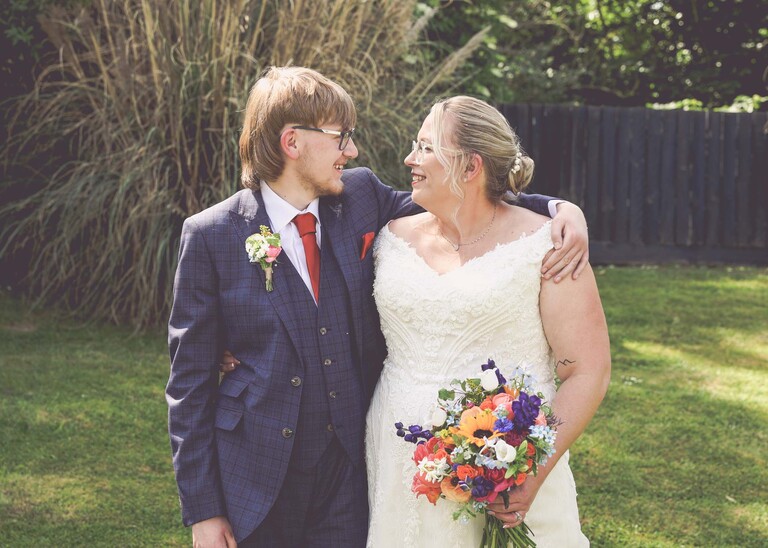 A bride and her son looking at each other on a wedding day at Venue 16 captured by suffolk wedding photographer Hayley Denston Photography