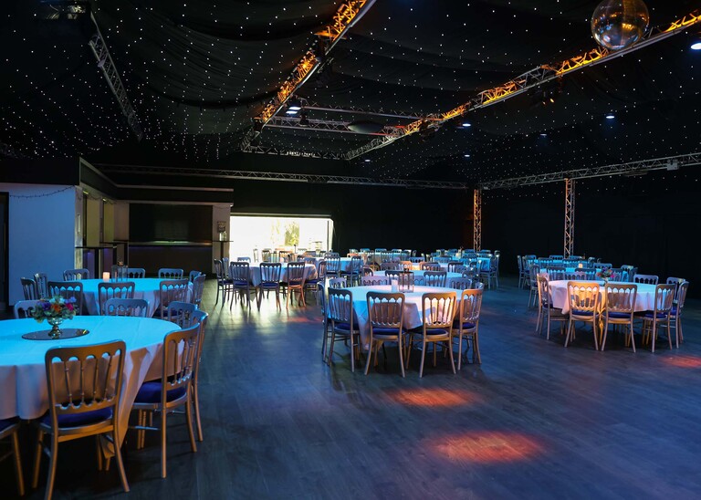 A venue set up for an evening wedding disco on a wedding day at Venue 16 captured by suffolk wedding photographer Hayley Denston Photography
