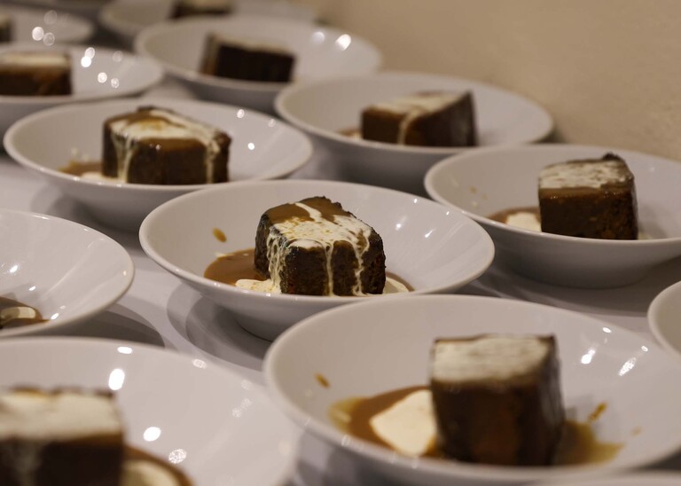 Sticky toffee pudding on a wedding day at Haughley Park Barn photographed by suffolk wedding photographer Hayley Denston Photography