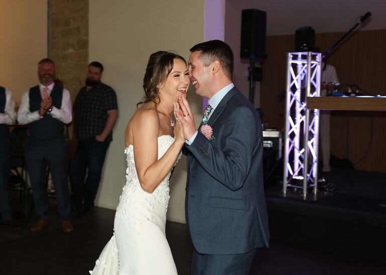 A bride and groom sharing their first dance on a wedding day at Little Green Wedding Barn photographed by suffolk wedding photographer Hayley Denston Photography