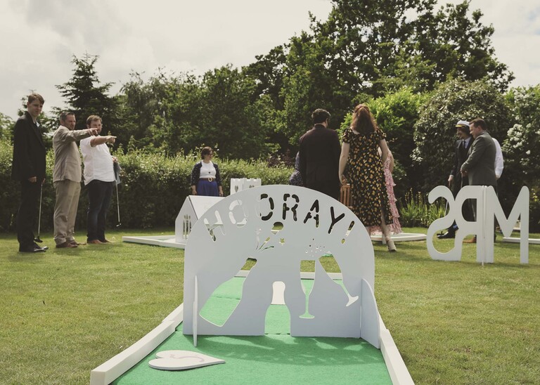 A mini golf course saying hooray at a wedding reception on a wedding day at Hungarian Hall Estate photographed by suffolk wedding photographer Hayley Denston Photography